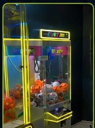 Claw machine filled with prize balls